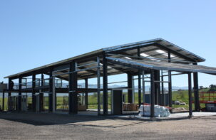 This custom structure features nearly 5,000 square feet of space. The clear span building features a second-floor partial mezzanine included in the office space and will have an open-air balcony for viewing the scenic surroundings and nearby mountains. A pre-engineered metal building was chosen for the ability to combine cost saving, pleasing aesthetics, and functionality.