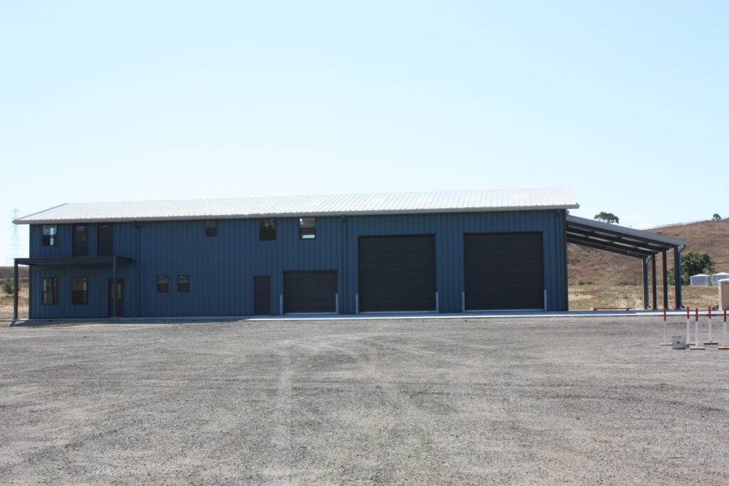 This custom structure features nearly 5,000 square feet of space. The clear span building features a second-floor partial mezzanine included in the office space and will have an open-air balcony for viewing the scenic surroundings and nearby mountains. A pre-engineered metal building was chosen for the ability to combine cost saving, pleasing aesthetics, and functionality.